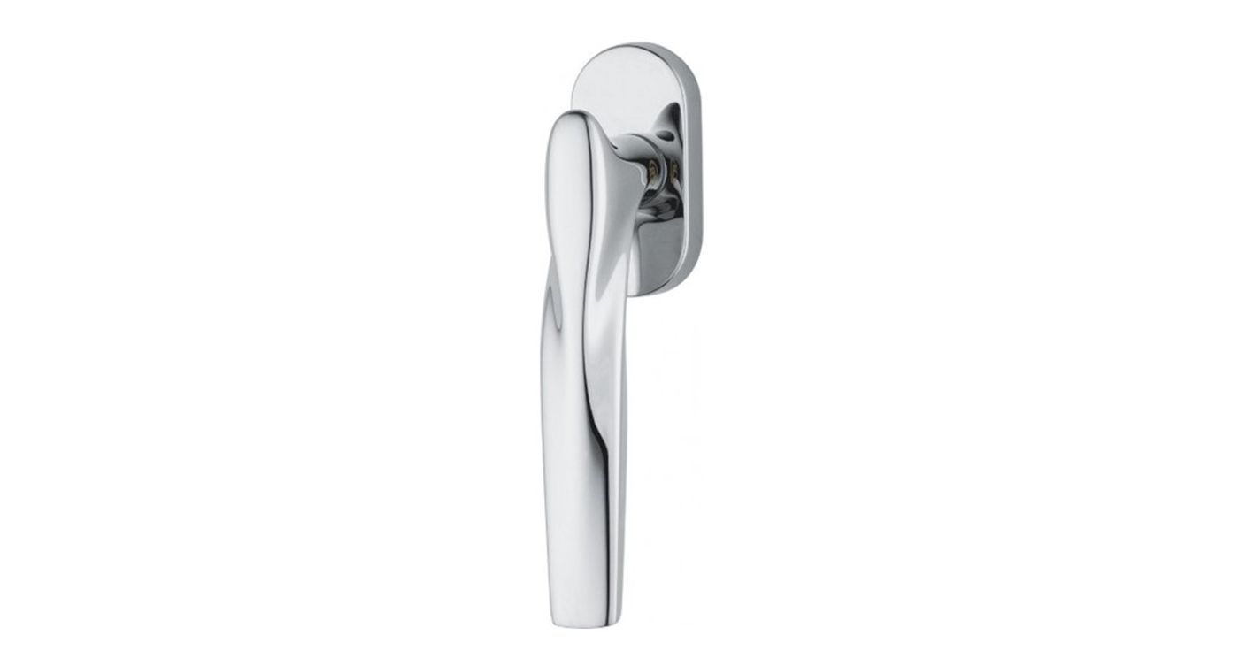 A polished window handle on an oval rose, seen from the front.