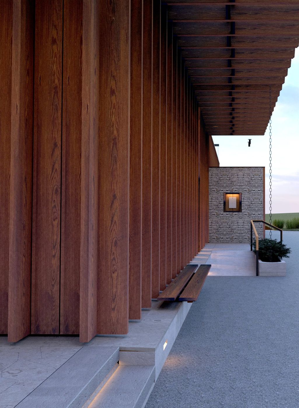 A covered walk between tall timber posts and a stone wall, a bench along the side.