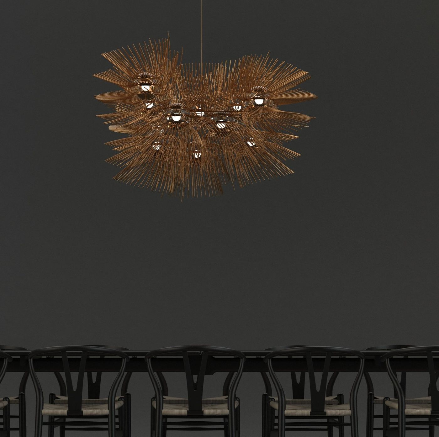 A brass fixture of radiating rods and glass globes hung above a dining table.