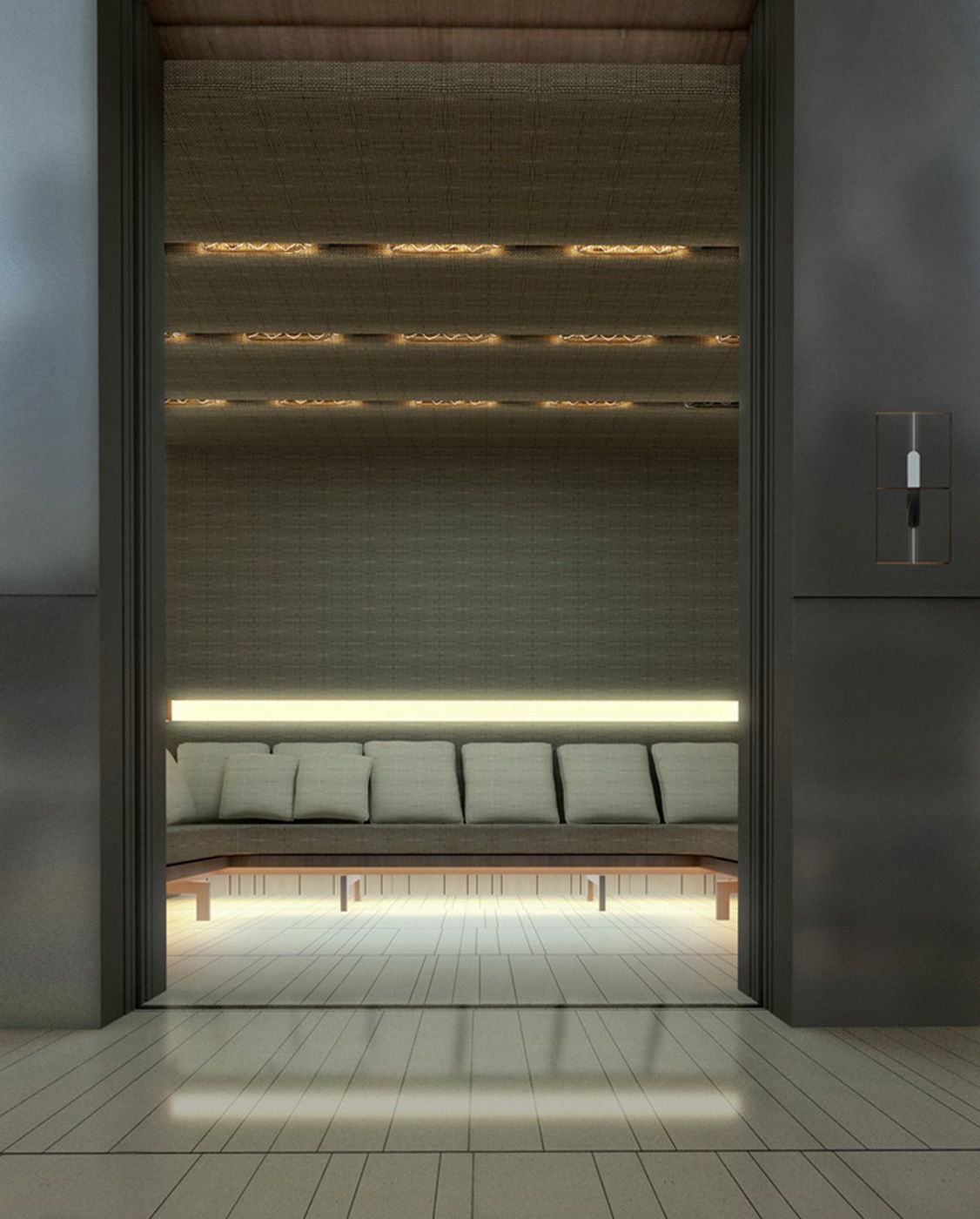 A lift car lined in dark panels with a lit bench and shelf across the back wall.
